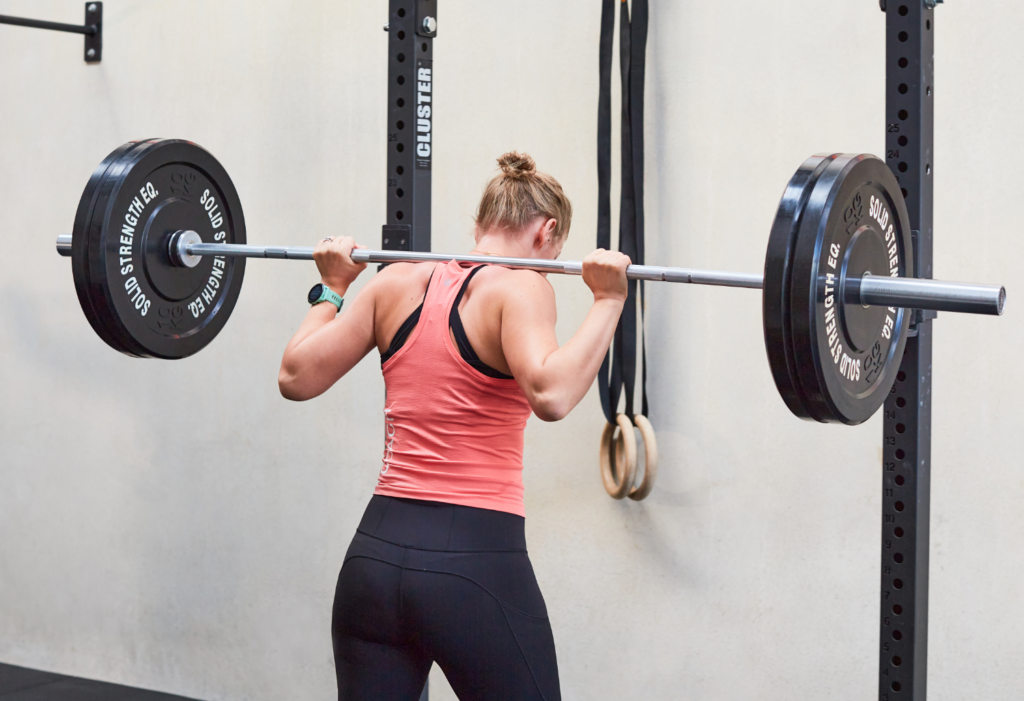 Woman lifts weights